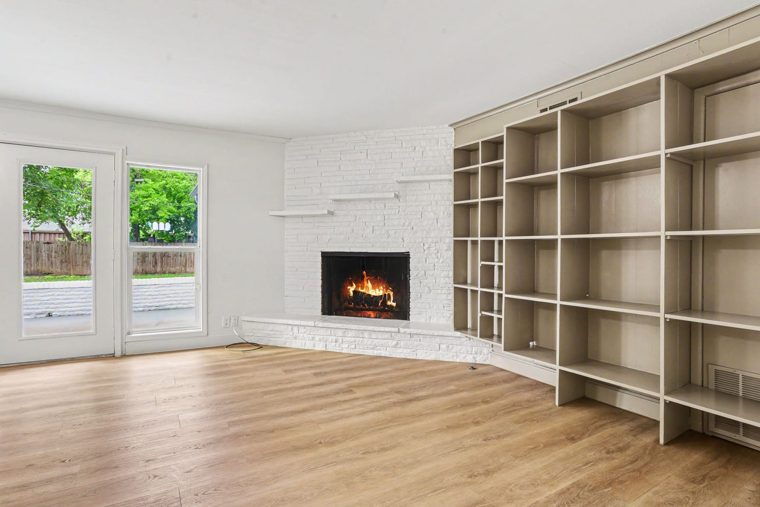 Room with fireplace and built-in shelves