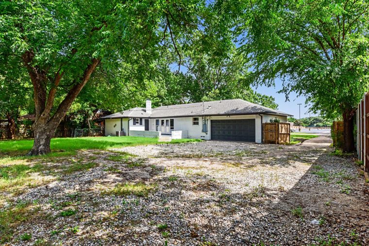 Backyard with mature oak tree